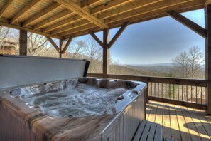 A hot tub on a wooden deck with a view of the mountains. - Tranquility Perch | 3-State Mtn Views + Hot Tub (Murphy)