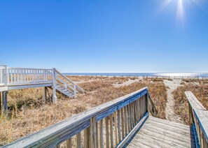 Walk along the boardwalk to the ocean and enjoy the view of the sandy dunes.