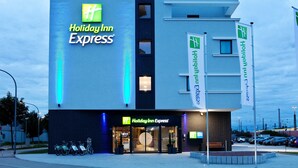 A Holiday Inn Express building with a modern design, large windows, and a visible entrance. - Holiday Inn Express Offenburg by IHG (Offenburg)