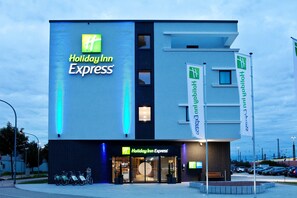 A Holiday Inn Express building with a modern design, large windows, and a visible entrance. - Holiday Inn Express Offenburg by IHG (Offenburg)