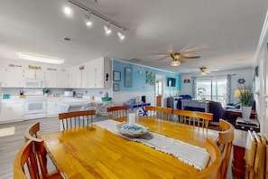 Enjoy meals in this well-equipped kitchen and dining area with a spacious table for six.