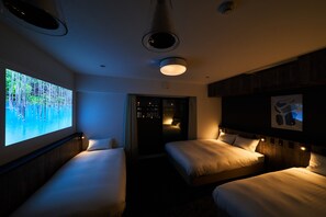 A hotel room with two beds, a large window with a projection, and a city view. - Grand STAY Hakata Station North (Fukuoka)