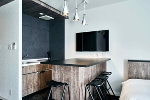 Desk, laptop workspace, blackout drapes, iron/ironing board