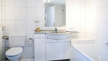 Bathtub, hair dryer, towels