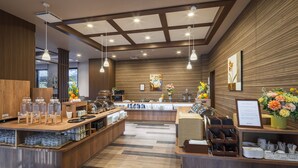 A modern cafe with a wooden counter, glass jars, and a menu board. - Route Inn Noda - Kokudou16gouzoi - (Noda)