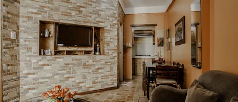 Suite, 2 Bedrooms | Living area | 32-inch flat-screen TV with cable channels, TV