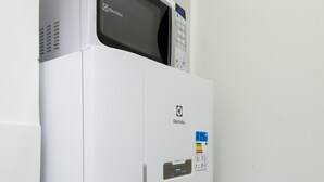 A white refrigerator with a digital display and a control panel on the door. - 6 Minutes From Ipanema Beach Gc707 (Rio de Janeiro)