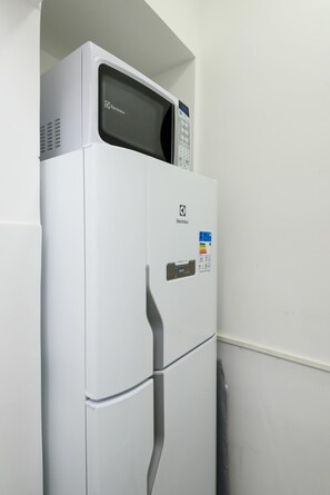 A white refrigerator with a digital display and a control panel on the door. - 6 Minutes From Ipanema Beach Gc707 (Rio de Janeiro)