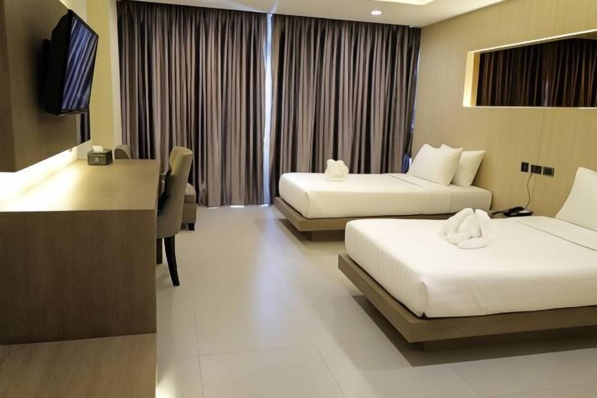 Premium bedding, pillow-top beds, free minibar items, blackout curtains