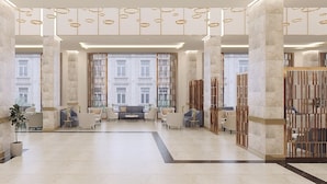A spacious lobby with high ceilings, large columns, and modern seating arrangements. - Hermann Hotel Pattaya (Pattaya)