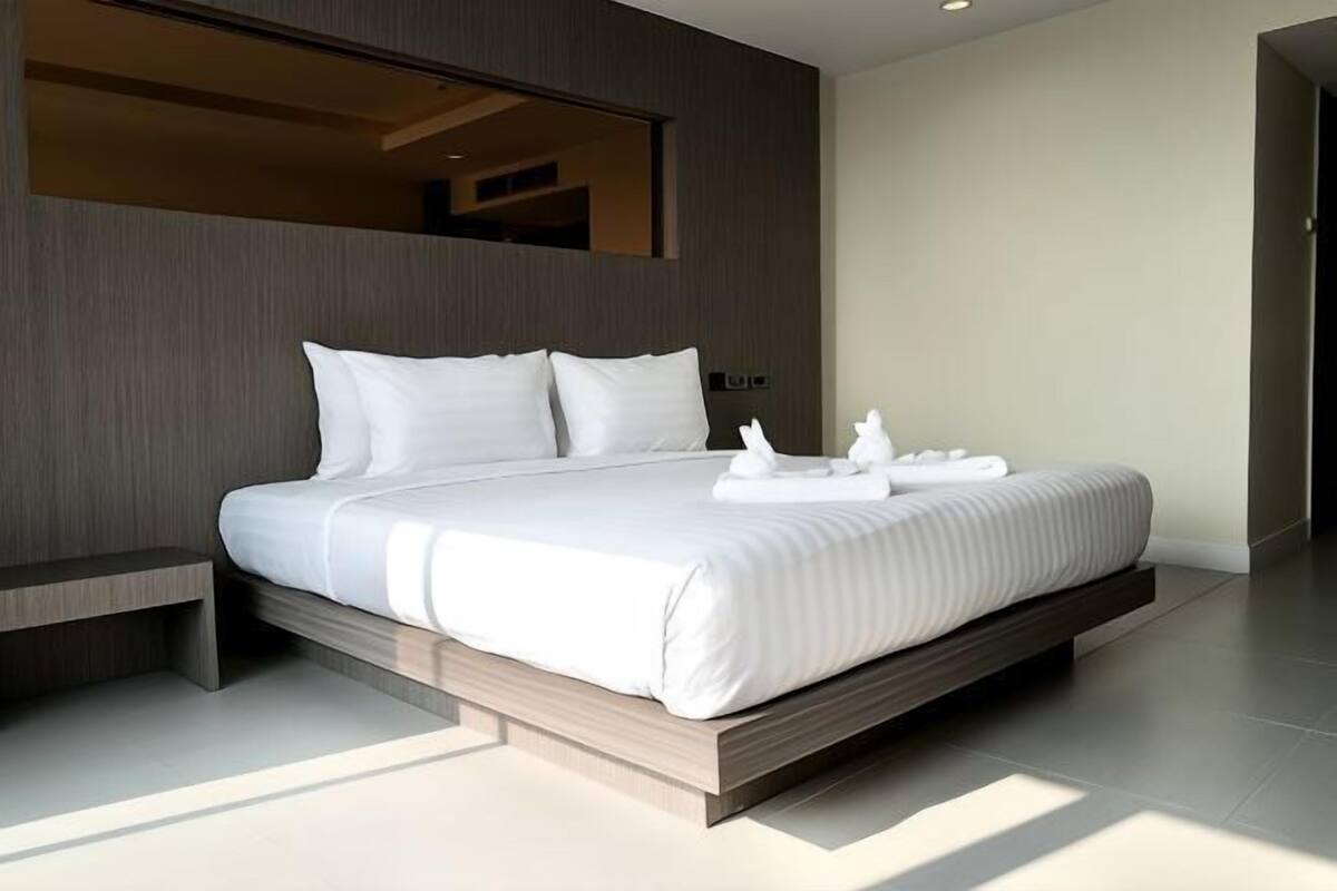 Premium bedding, pillow-top beds, free minibar items, blackout curtains