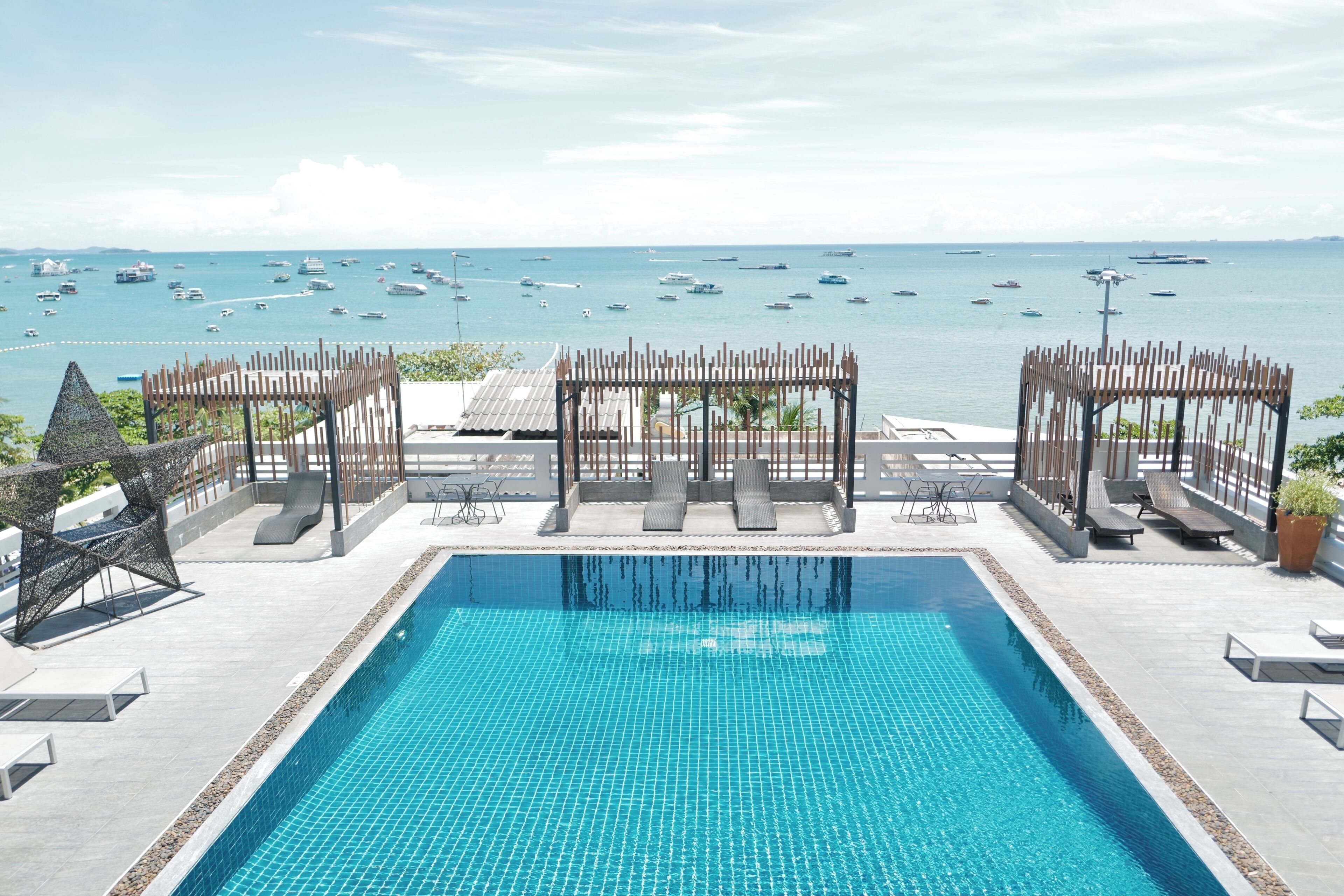 Outdoor pool, open 9:00 AM to 7:00 PM, pool umbrellas, pool loungers