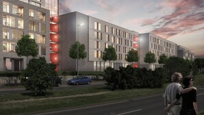 A modern building with multiple floors, large windows, and a mix of brick and glass facades. - ipartment Braunschweig @HOME by Best Western (Braunschweig)