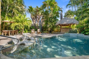 A heated pool, pool loungers