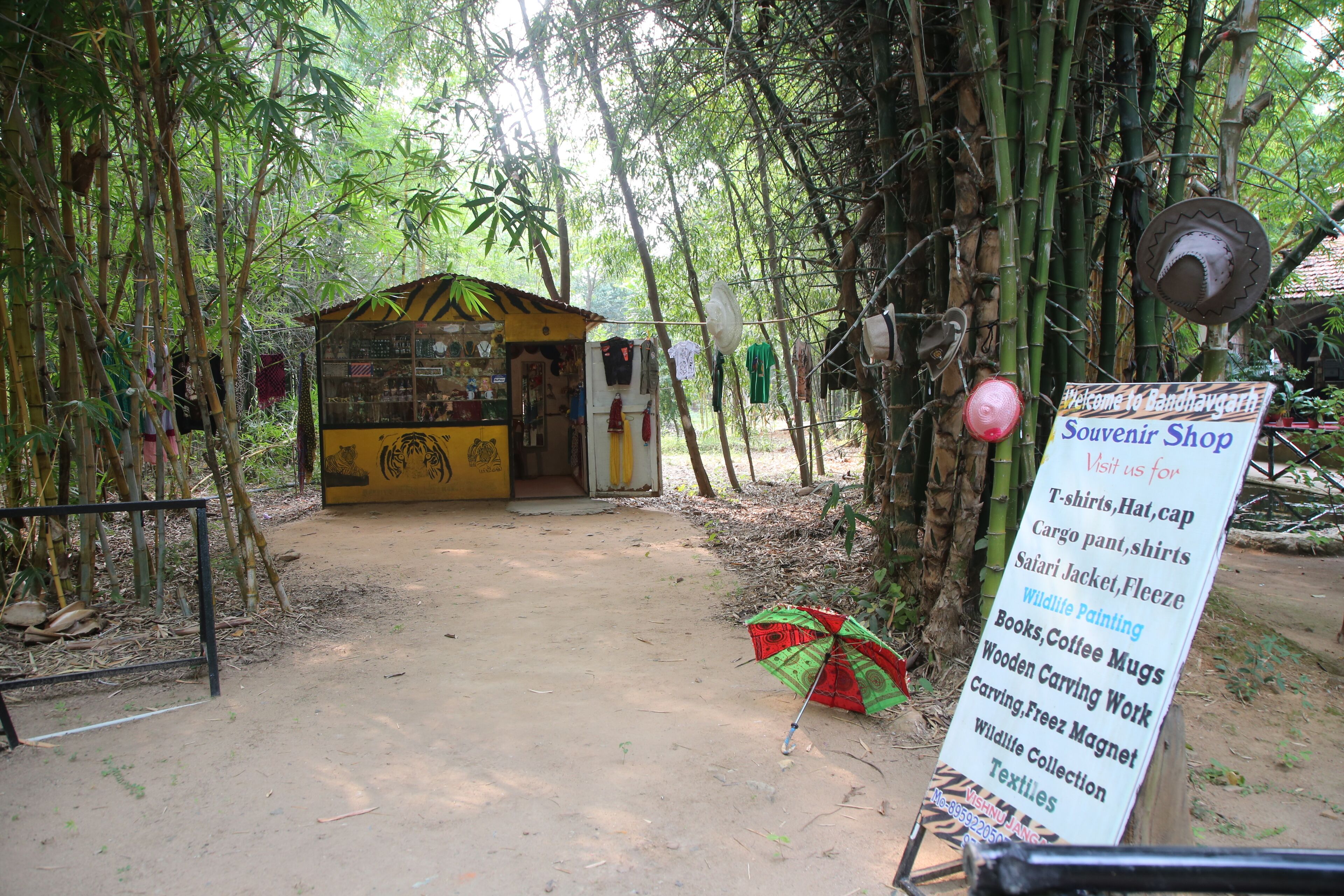 A souvenir shop with a sign listing items for sale.