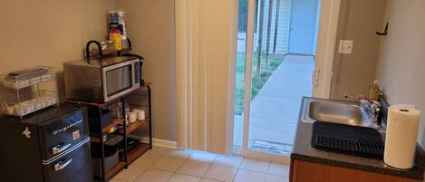 Fridge, microwave, stovetop, coffee/tea maker