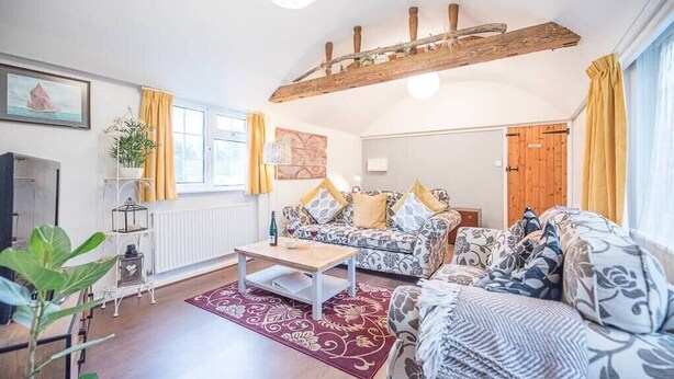 A cozy living room with a sofa set, a coffee table, and a radiator. - Suncatch Corner, Saxmundham (Saxmundham)