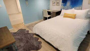 1 bedroom, desk, iron/ironing board, travel crib