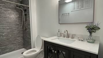 Combined shower/tub, hair dryer, towels, soap