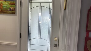 A white door with a glass panel and a brass handle. - Cozzy Get Away Priv. Apt/ St BarnabaS Hosp/NYC/EWR (Livingston)