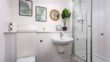 Bathtub, hair dryer, towels