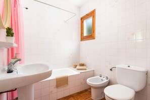 Bathtub, hair dryer, towels