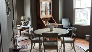 A room with a round table, chairs, a cabinet, and a window. - Cozy and artistic Pied-a-Terre, perfect for a weekend romantic getaway. (Little Falls)