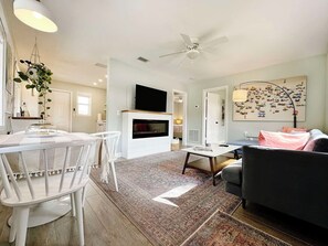 Smart TV, fireplace, books, printers