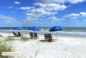 On the beach, sun loungers, beach towels