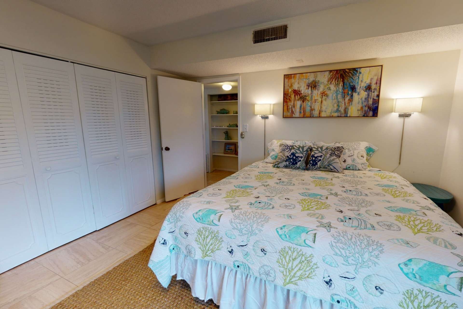 A bedroom with a bed, a wardrobe, a shelf with decorative items, and a painting on the wall.