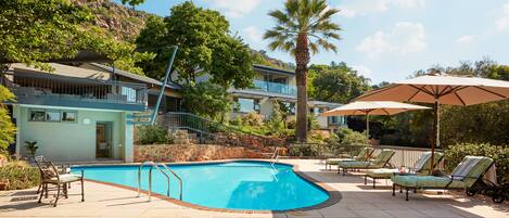 Outdoor pool, open 6:00 AM to 10:00 PM, pool umbrellas, sun loungers