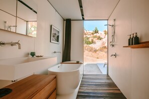 Bathtub, hair dryer, towels, soap