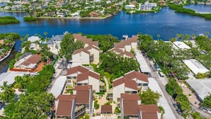 A residential area with houses and a swimming pool. - Bay Oaks C Ground Floor (Siesta Key)