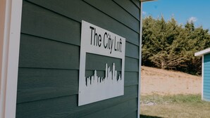 A sign on a building that reads "The City Loft." - City Loft  (Trenton)