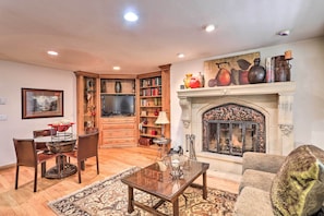 TV, fireplace, books