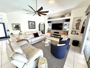 TV, DVD player, books, music library - Villa Fish & Sips 1023 - Cape Coral 3b/2ba  luxury home w/electric heated pool, gulf access canal (Cape Coral)