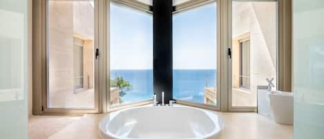 Bathtub, hair dryer, towels