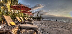 On the beach, sun-loungers
