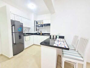 Fridge, microwave, stovetop, coffee/tea maker