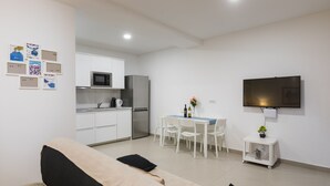 A modern apartment with a living room, kitchenette, and dining area. - Apartment Navigator (Dubrovnik)