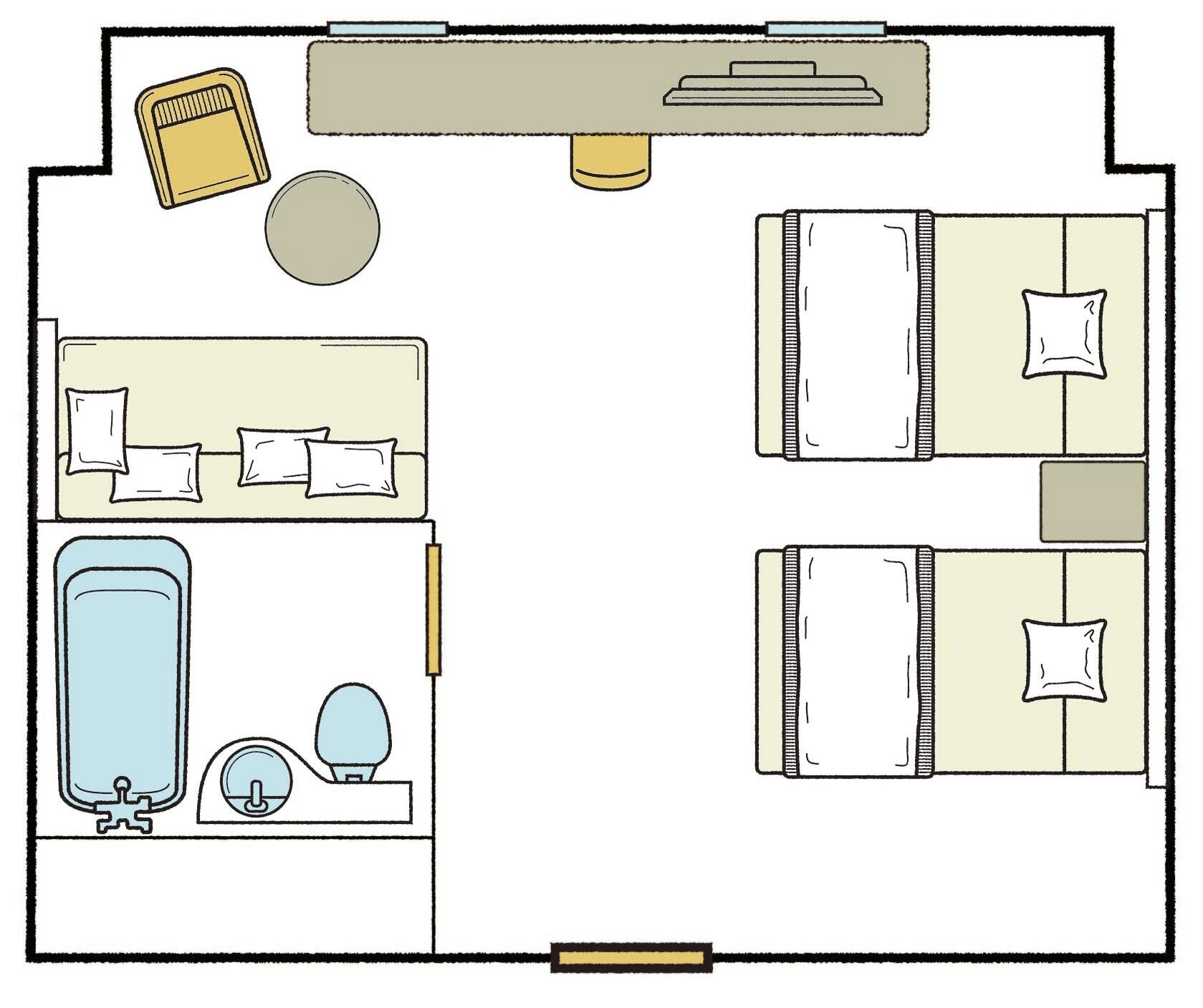 A hotel room layout with a bed, bedside table, lamp, and a bathroom with a sink and toilet.