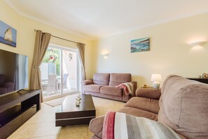 TV, fireplace, books, printers