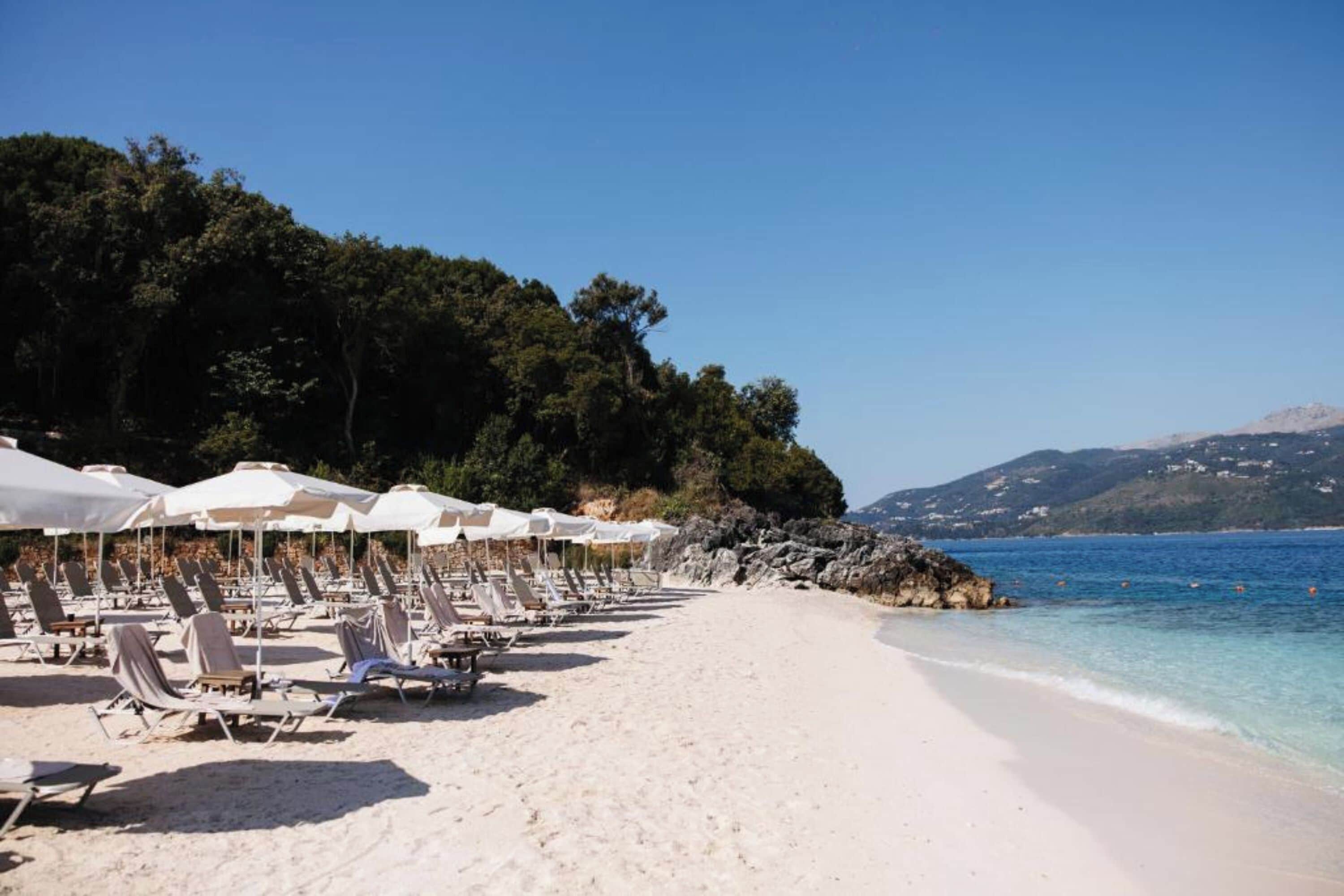 On the beach, white sand, beach umbrellas, beach bar