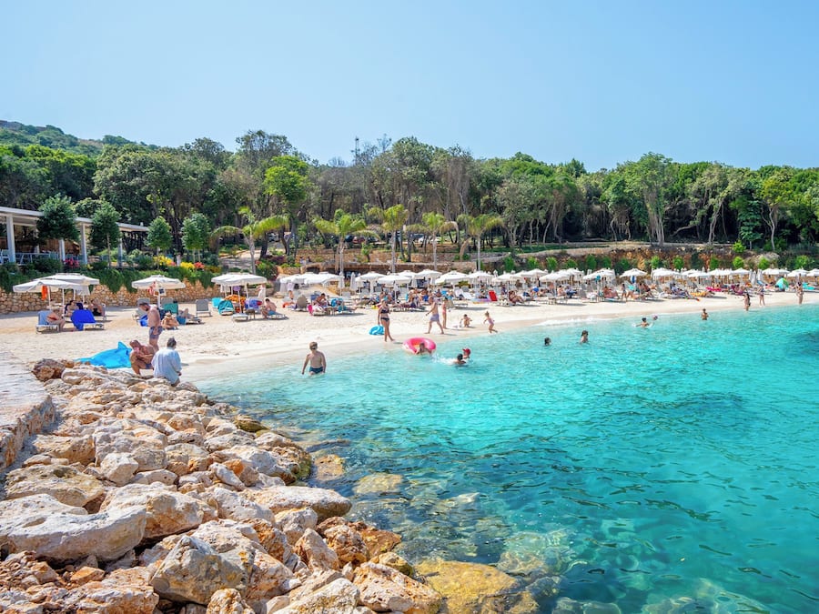 On the beach, white sand, beach umbrellas, beach bar