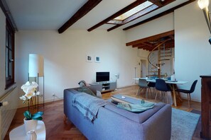Basic Apartment, Multiple Beds | Living room | TV