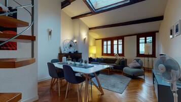 Basic Apartment, Multiple Beds | Living room | TV