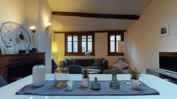 Basic Apartment, Multiple Beds | Living room | TV