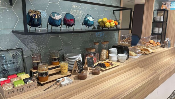 A breakfast buffet with various food items and condiments. - Kyriad Direct  - Bourg les Valence (Bourg-les-Valence)