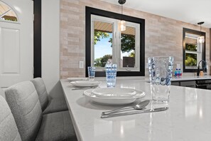 Enjoy cooking in this well-equipped kitchen with a sink and ample natural light.