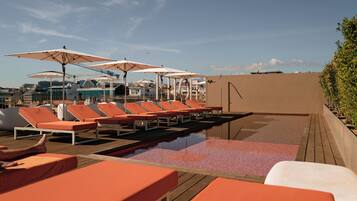 Seasonal outdoor pool, pool umbrellas